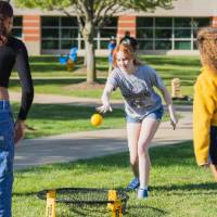 Students playing spike ball on Kirkhof Lawn.